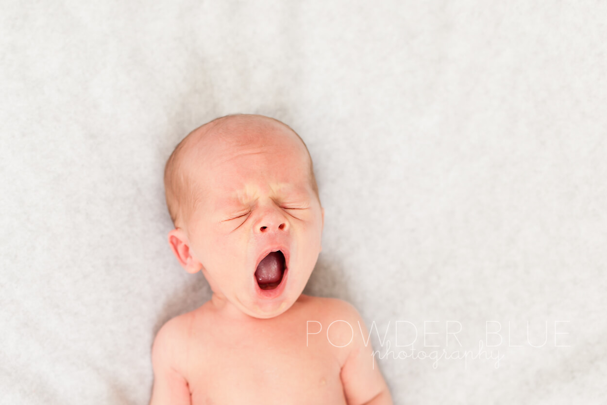 yawning newborn baby boy