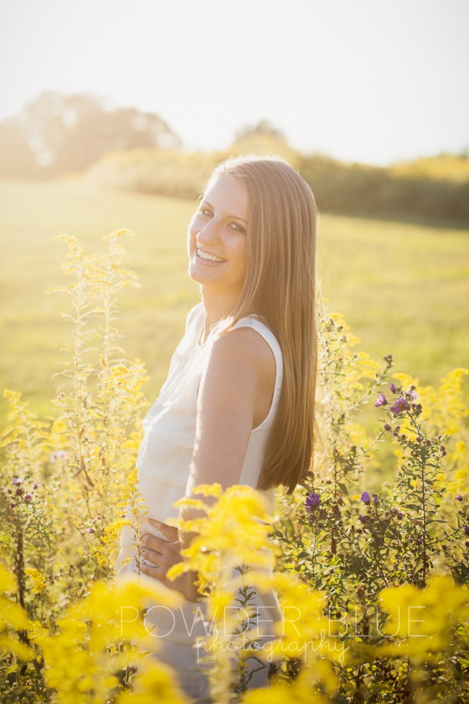 senior girl standing in a field pittsburgh backlit 