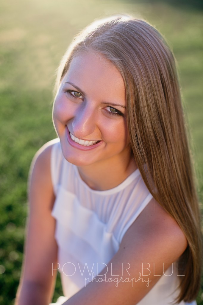 senior girl standing in a field pittsburgh backlit using zebra reflector