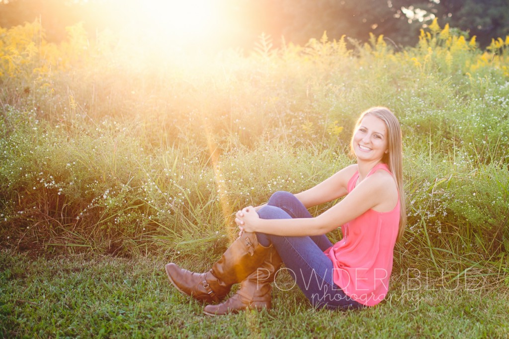 senior girl standing in a field pittsburgh backlit using flash on exposure compensation