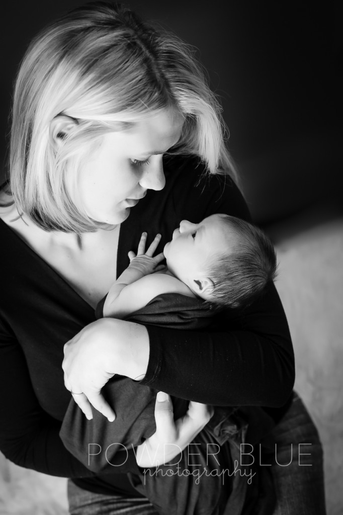 black and white studio portrait mom holding newborn baby girl © 2013 Powder Blue Photography. www.powderbluephoto.com