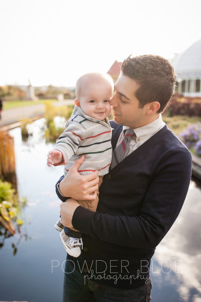 father holding baby son schenley park photographer portrait fall leaves pittsburgh portuguese water dog