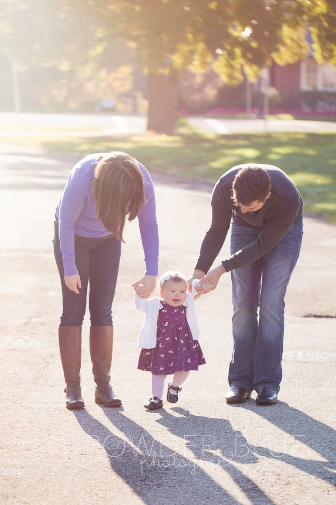 family walking with 8 month old baby girl