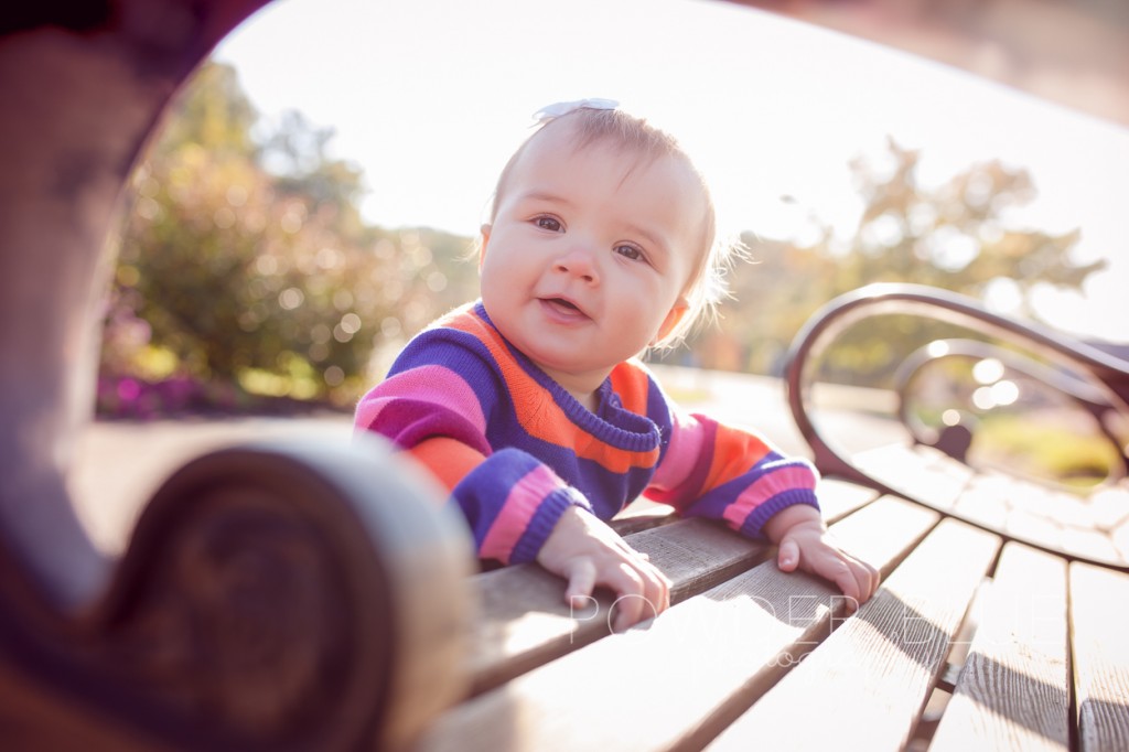 8 month old baby girl in a striped dress at schenley park