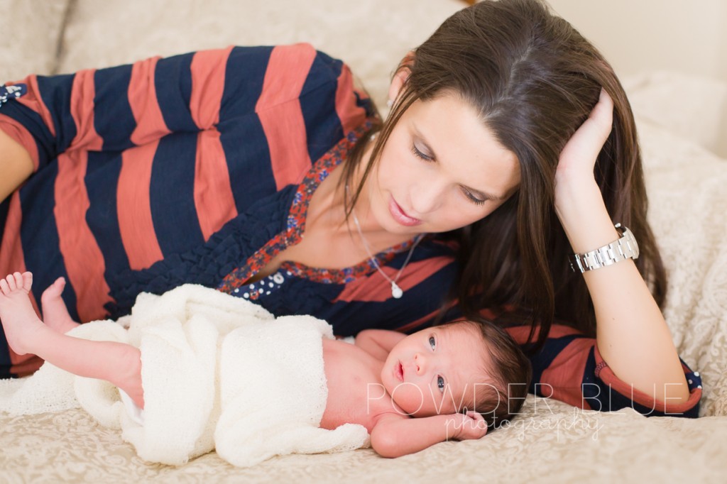 mom looking at newborn baby boy