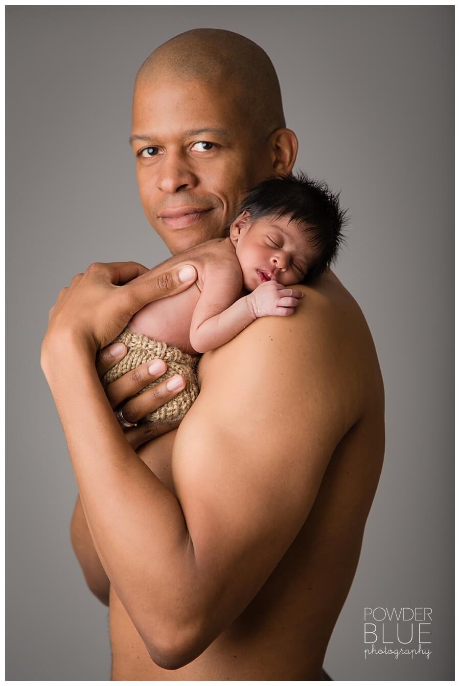 dad shirt off newborn portrait bicep studio pittsburgh