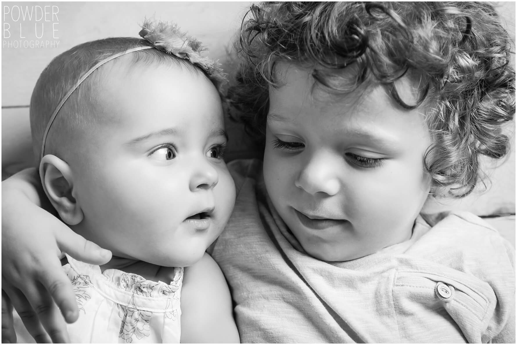pittsburgh studio portrait session with a 3-year-old boy and a 6-month girl on a grey backdrop with a single light source