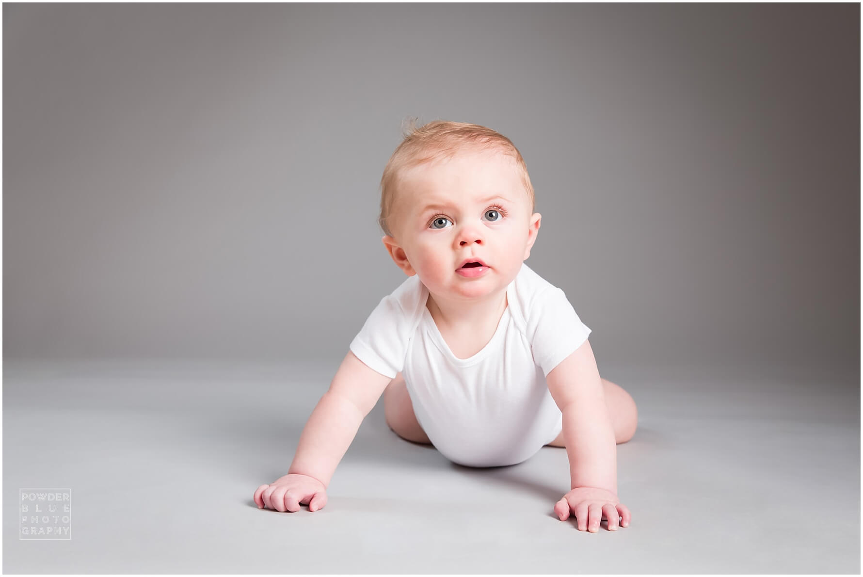 baby portrait in studio seamless savage backdrop grey