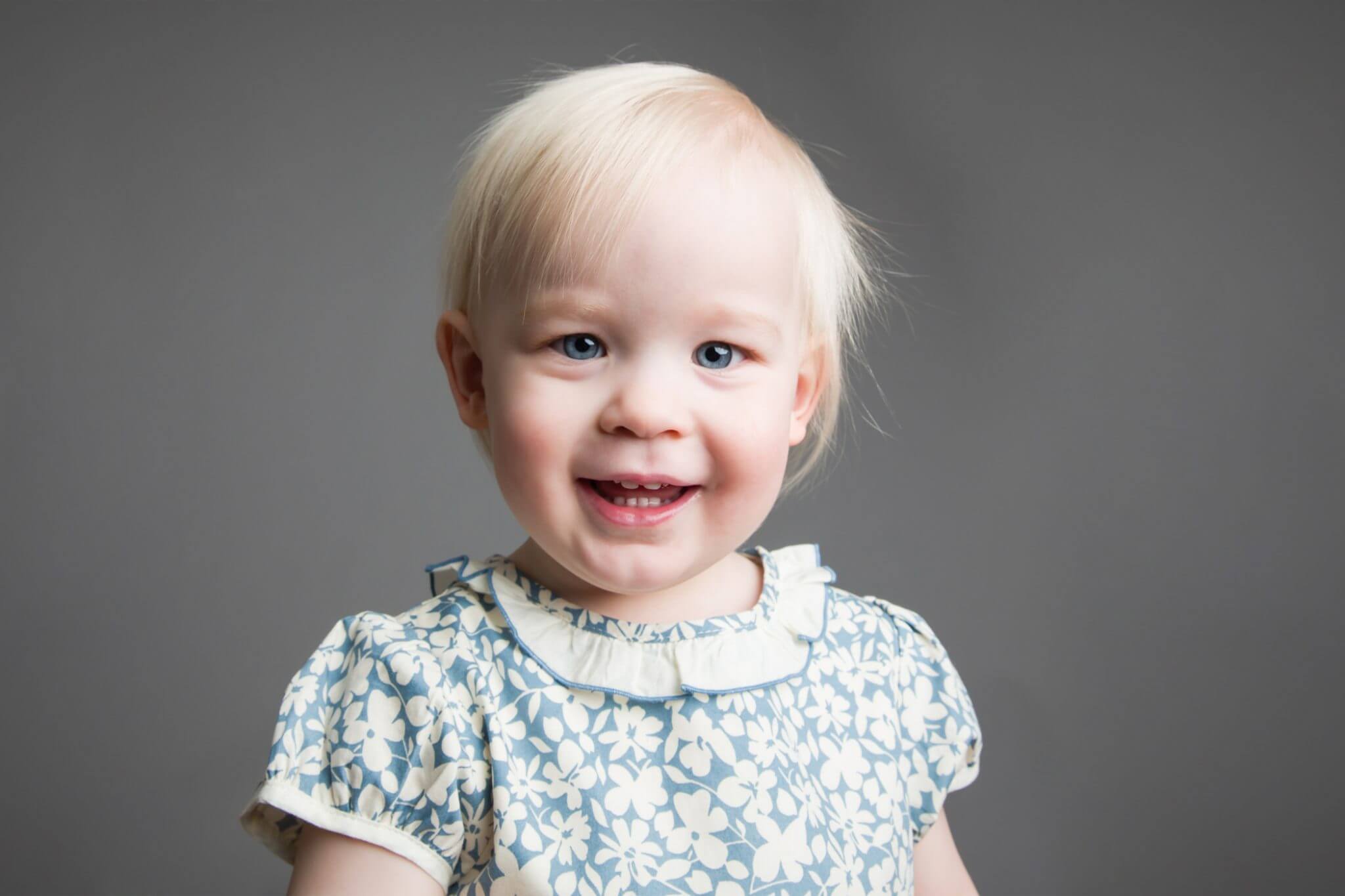 two year old toddler girl studio portrait session grey backdrop, simple, clean, timeless