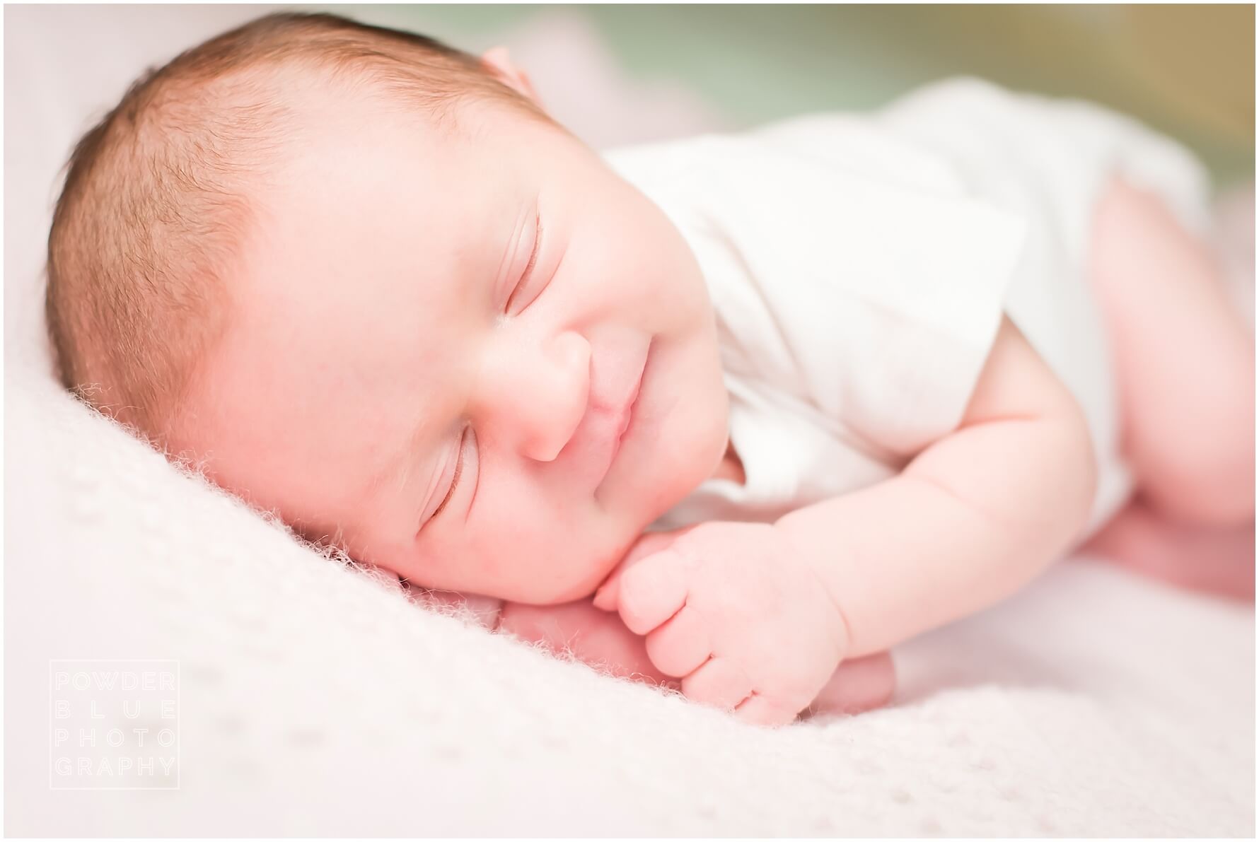 lifestyle newborn session in home colorful blankets pittsburgh