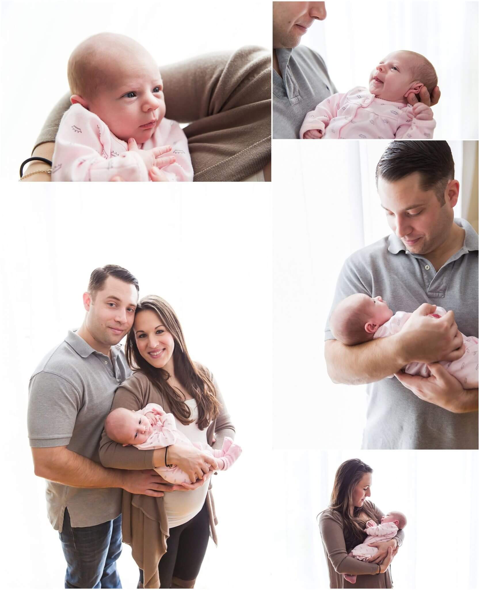 lifestyle newborn session. family holding newborn baby girl using large window as softbox backlighting them.