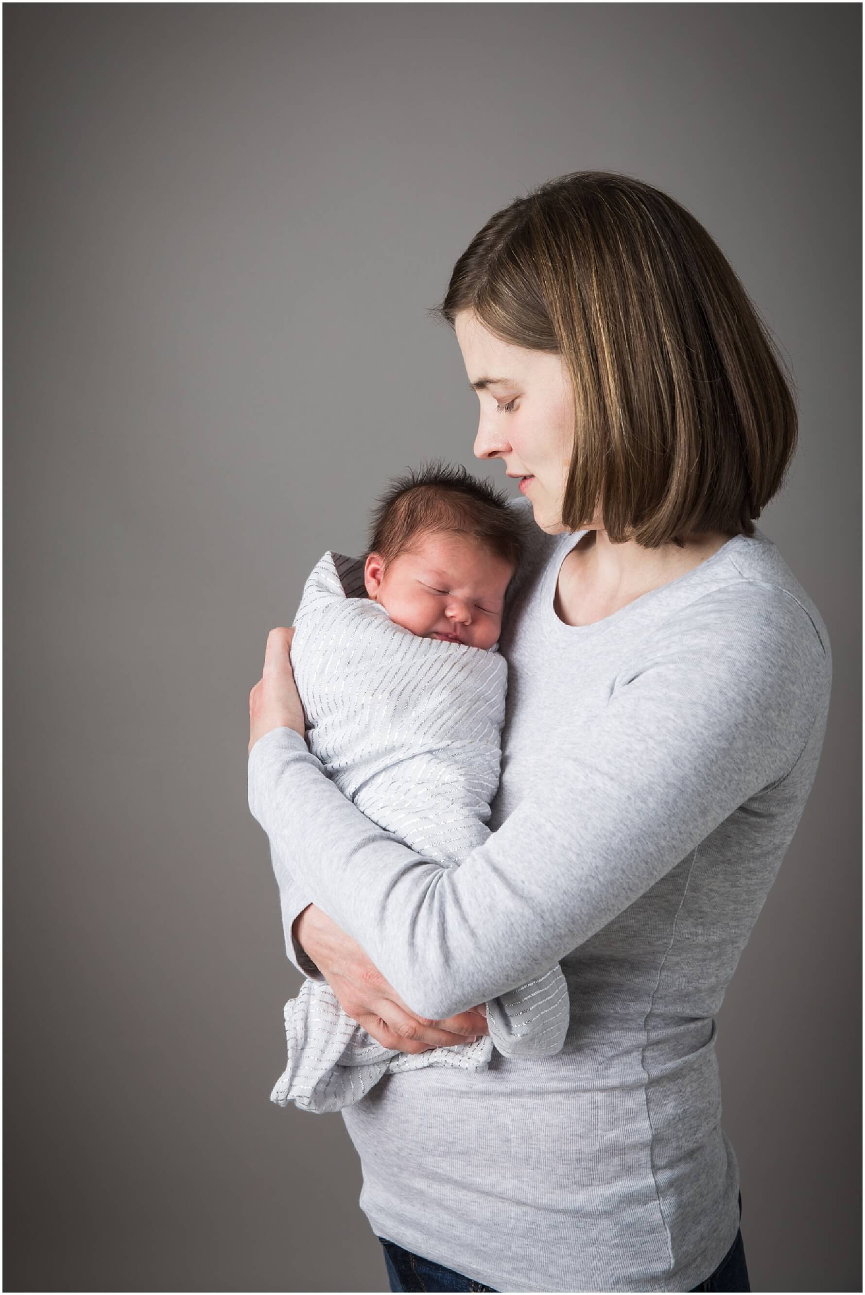 pittsburgh newborn photographer. simple, natural newborn portrait in studio on a white backdrop. baby girl. no props.