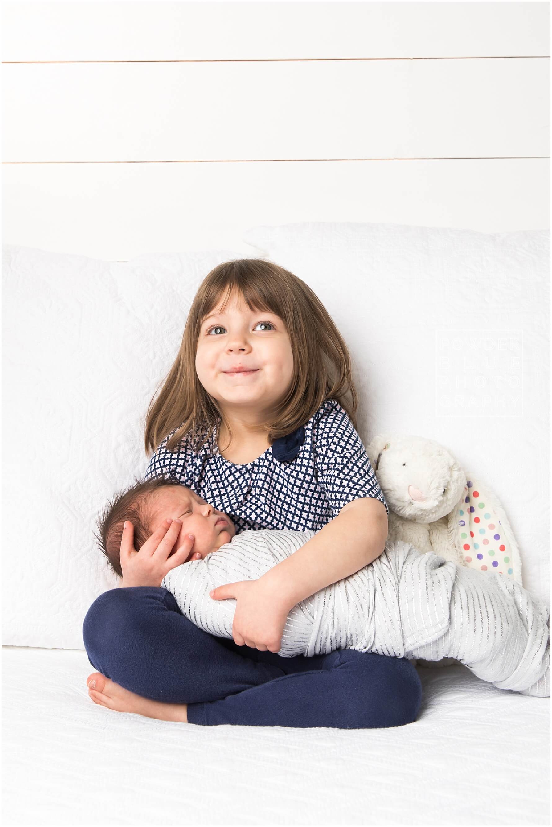 pittsburgh newborn photographer. simple, natural newborn portrait in studio on a white backdrop. baby girl. no props.