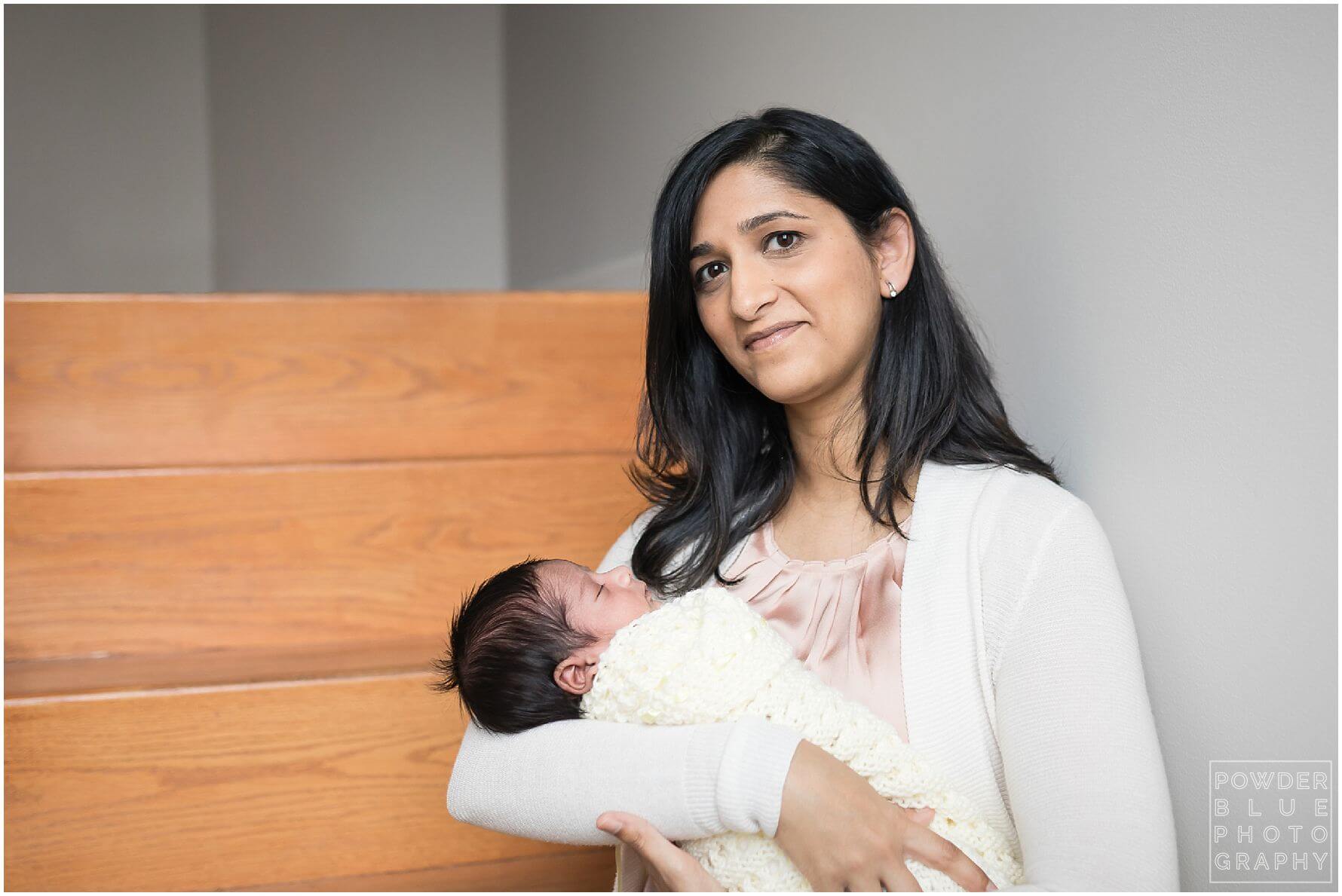 pittsburgh newborn photographer lifestyle photography session. newborn baby in black & white and color portraits on a bed in a home.