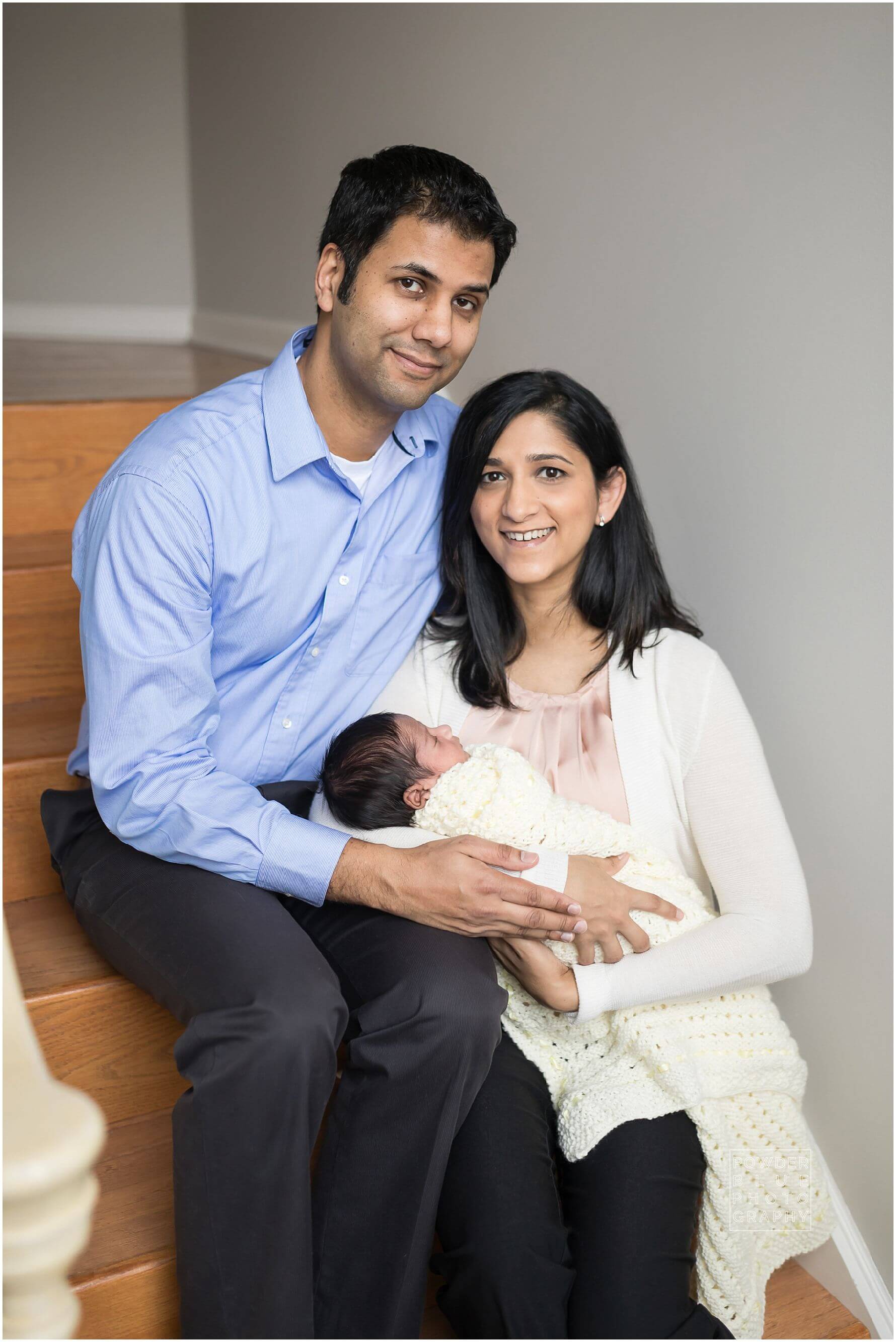 pittsburgh newborn photographer lifestyle photography session. newborn baby in black & white and color portraits on a bed in a home.