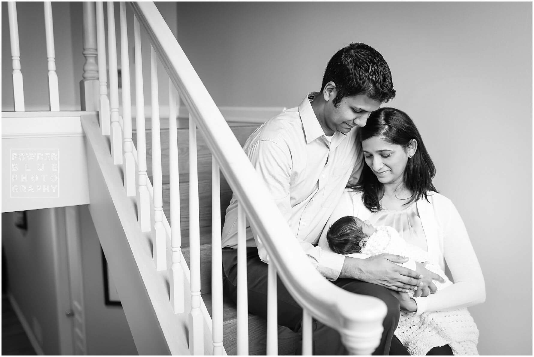 pittsburgh newborn photographer lifestyle photography session. newborn baby in black & white and color portraits on a bed in a home.