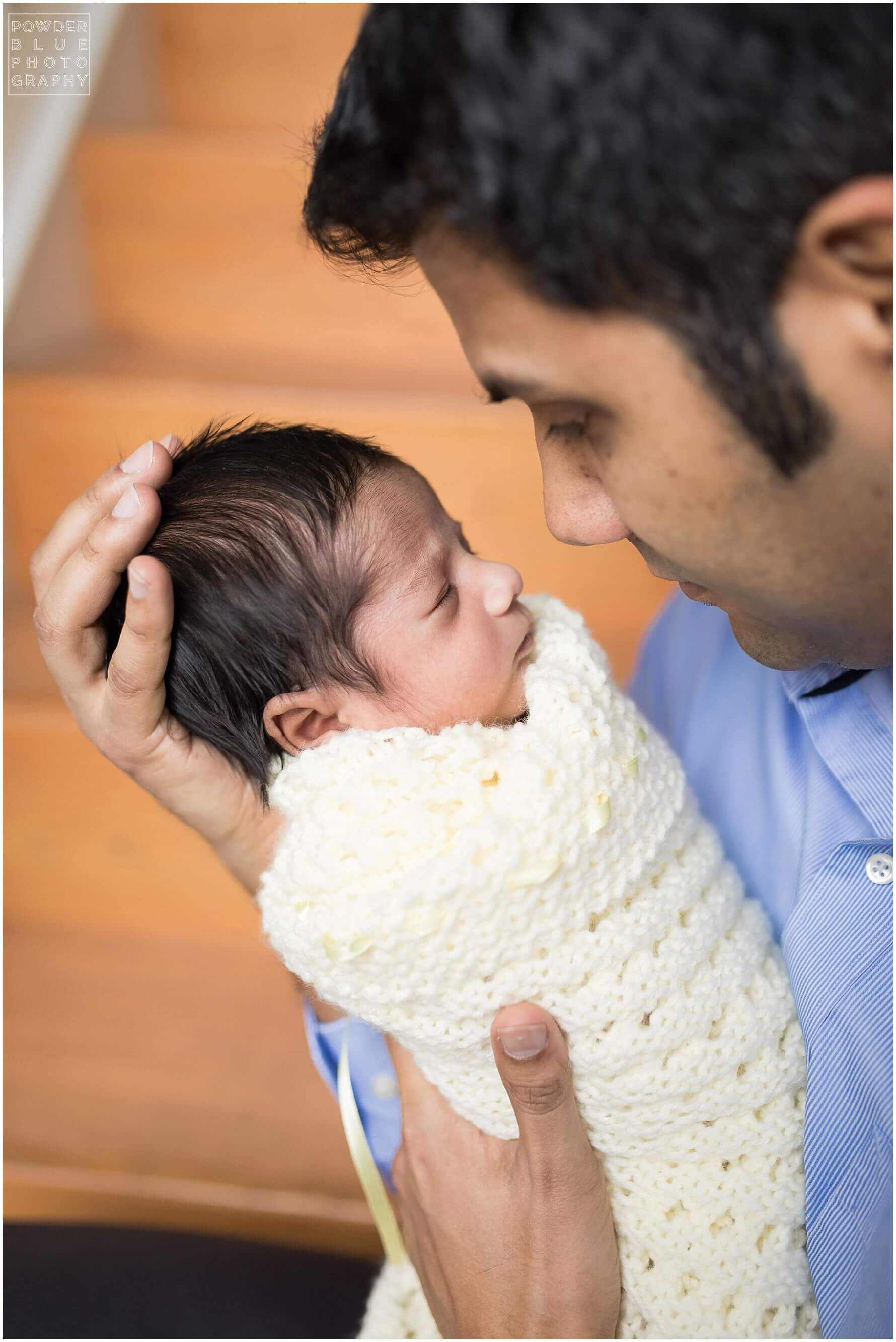 pittsburgh newborn photographer lifestyle photography session. newborn baby in black & white and color portraits on a bed in a home.