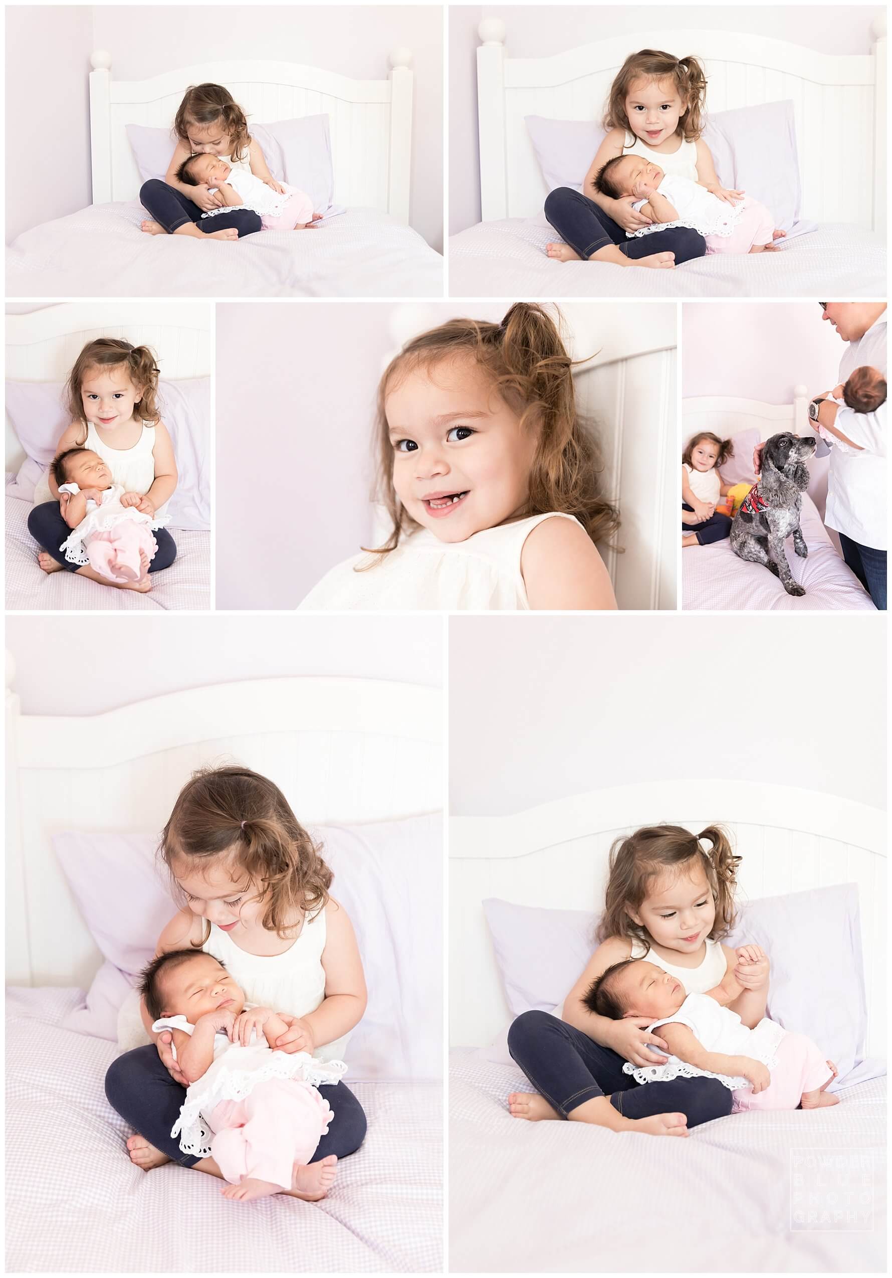 pittsburgh newborn photographer. simple, natural newborn portrait in studio on a white bed. baby girl. sister. no props.