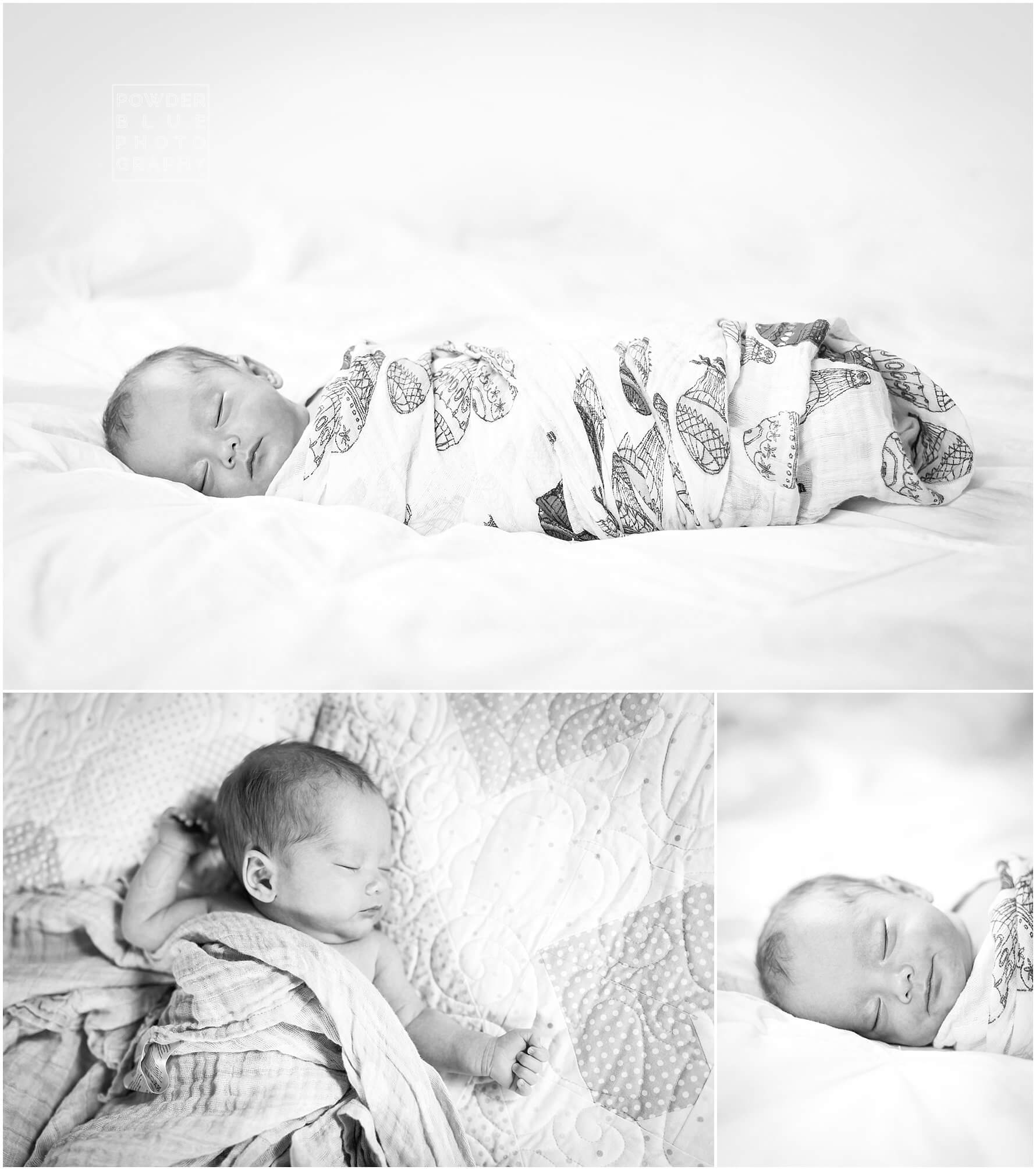 black and white baby portrait on a bed